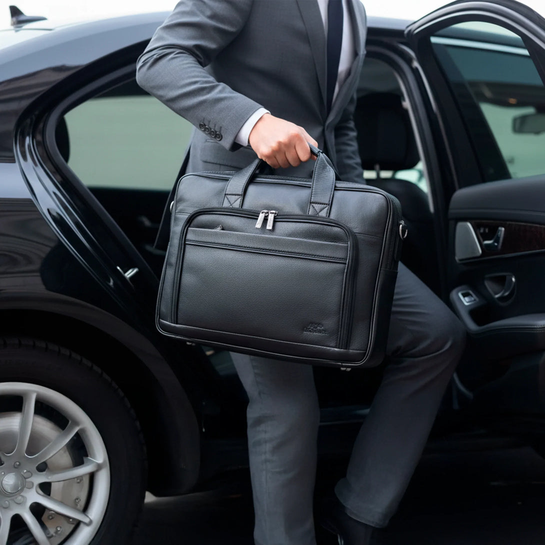 Personalized black leather wallet and belt gift set for men shown with stylish business briefcase