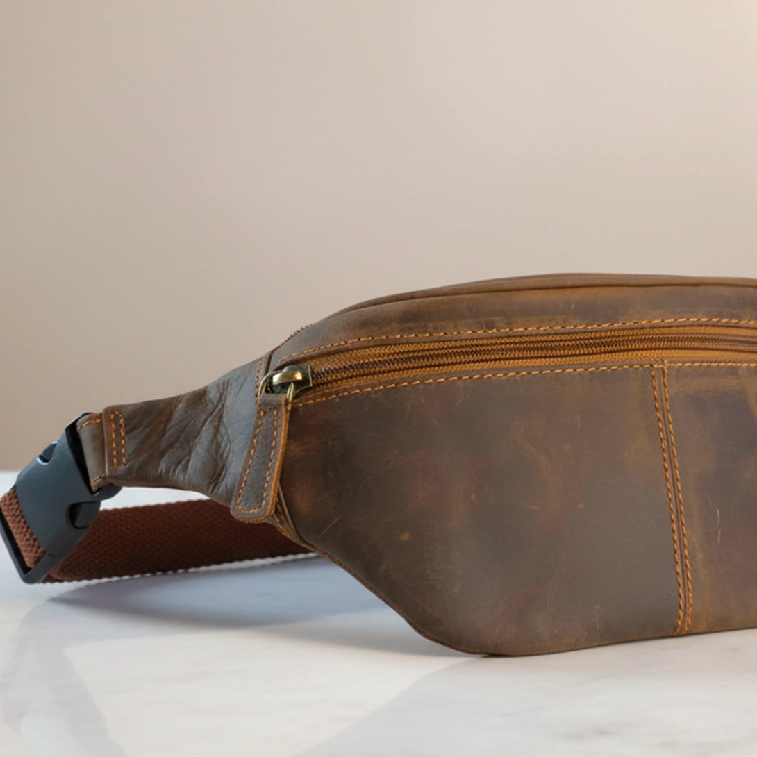 brown personalized leather wallet and belt gift set for men on marble surface